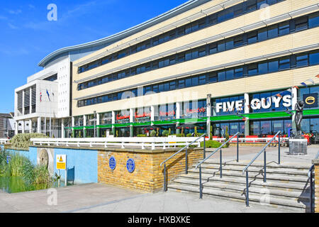 Five Guys Nandos & Pizza Express restaurants fast food business with outdoor eating space at Harlow New Town Civic Centre building Essex England UK Stock Photo