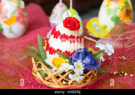 Decorated Easter candles in the form of eggs. Stock Photo