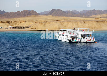 SHARM EL SHEIKH, EGYPT -  DECEMBER 4: Snorkeling tourists and motor yachts on Red Sea in Ras Muhammad National Park. It is popular tourists destinatio Stock Photo