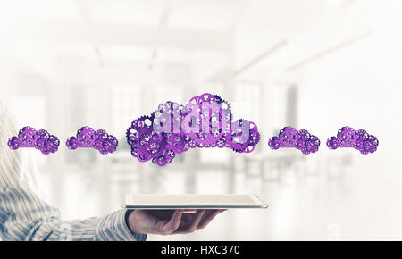 Close of businessman presenting tablet pc and cloud computing concept. Mixed media Stock Photo