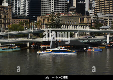 Brisbane, Australia: A CityCat public transport ferry passing the Riverside Expressway on the Brisbane River Stock Photo