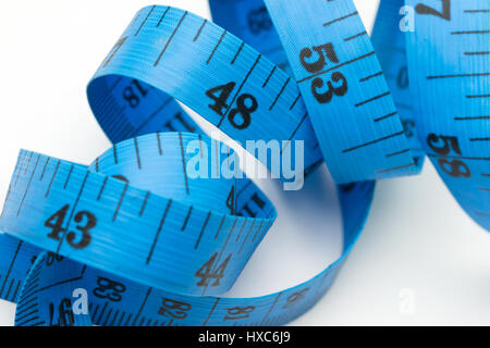 Blue measuring tape for tailor on white background Stock Photo