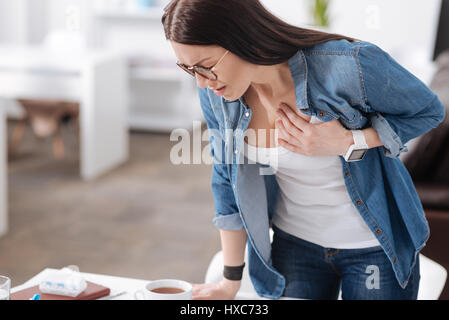 Young woman having health problems Stock Photo