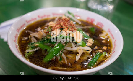 Closeup of Vegetable Japanese Ramen Noodles with Dark Broth Stock Photo