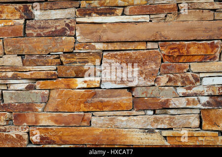 Close-up detail of a woven drystone lattice building wall. Stock Photo