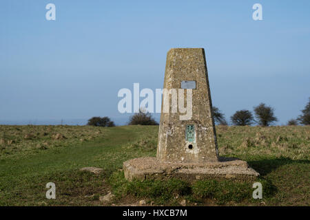 Ordnance Survey Trig Point on top of Butser Hill, Queen Elizabeth Country park, Hampshire, England, United Kingdom Stock Photo