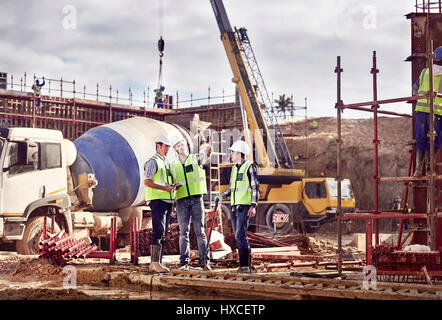 Construction workers working at construction site Stock Photo