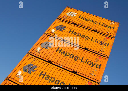Container of the Hapag-Lloyd about one another stacked on a place in the container port, container from Hapag-Lloyd stacked in a square in container p Stock Photo