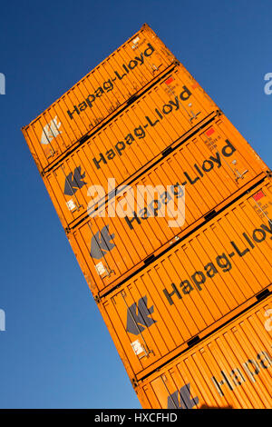 Container of the Hapag-Lloyd about one another stacked on a place in the container port, container from Hapag-Lloyd stacked in a square in container p Stock Photo