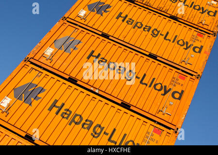 Container of the Hapag-Lloyd about one another stacked on a place in the container port, container from Hapag-Lloyd stacked in a square in container p Stock Photo