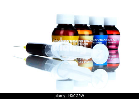 Syringe and coloured ink, Spritze und farbige Tinte Stock Photo