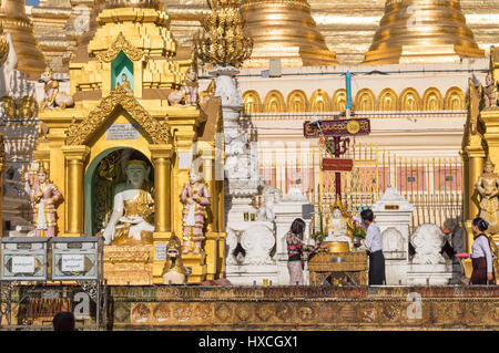 People praying at Shwedagon Pagoda in Yangon, Burma Myanmar Stock Photo