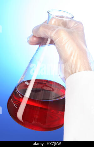 Hand with Erlenmeyer flask, Hand mit Erlenmeyerkolben Stock Photo