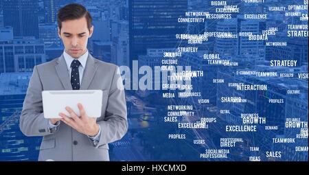 Digital composite of Businessman on tablet against Night city with connectors Stock Photo