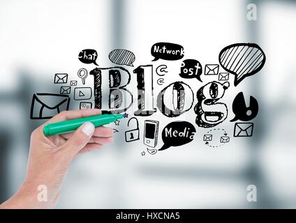 Digital composite of Hand with pen and black blog doodles against blurry grey panel Stock Photo