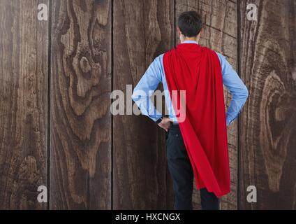 Digital composite of Business Superhero against wood Stock Photo - Alamy