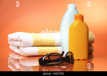 Sunglasses, towel and solar milk, Sonnenbrille, Handtuch und Sonnenmilch Stock Photo