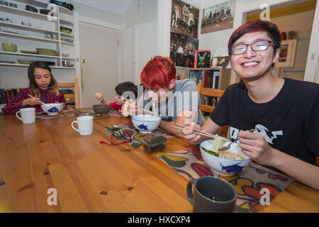 Sydney, Australia. 15th Mar, 2017. University of Sydney master's student Jony Sun (1st R) has dinner with his hostess Miri Furlong (2nd R) and her children in Sydney, Australia, on March 15, 2017. International trade deals, bilateral agreements and strategic business partnerships are often considered the most important aspects of international relations. But the richest foundation for cross-cultural communication between China and Australia lies with the 90,000 Chinese students studying in Australia and living among Aussie families. Credit: Zhu Hongye/Xinhua/Alamy Live News Stock Photo