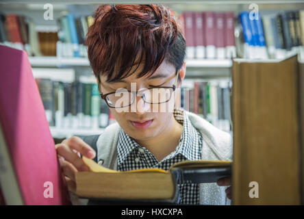 Sydney, Australia. 16th Mar, 2017. University of Sydney master's student Jony Sun reads a book at the library in Sydney, Australia, on March 16, 2017. International trade deals, bilateral agreements and strategic business partnerships are often considered the most important aspects of international relations. But the richest foundation for cross-cultural communication between China and Australia lies with the 90,000 Chinese students studying in Australia and living among Aussie families. Credit: Zhu Hongye/Xinhua/Alamy Live News Stock Photo