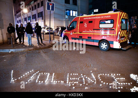 Paris, France. 27th Mar, 2017. The word 'violence' formed with candles is seen during a demonstration against police in front of a police station in Paris, France, March 27, 2017. About 100 people from the Chinese community held a demonstration Monday evening in front of a police station in the 19th arrondissement of Paris to protest against police killing of a Chinese national in a conflict Sunday night. Credit: Chen Yichen/Xinhua/Alamy Live News Stock Photo