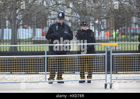 London, UK. 28th March 2017. Unarmed police officers stand at the gates outside Parliament in Westminster , in response to Khalid Masood's terrorist attack and the killing of PC Keith Palmer. Credit: Vickie Flores/Alamy Live News Stock Photo