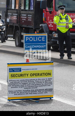 London, UK. 28th Mar, 2017. Police man at security checkpoint on Waterloo Bridge as the capital sees a marked increase in visible policing following the Westminster Bridge attack on the 22nd. Credit: Paul Davey/Alamy Live News Stock Photo