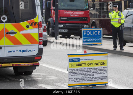 London, UK. 28th Mar, 2017. Police man at security checkpoint on Waterloo Bridge as the capital sees a marked increase in visible policing following the Westminster Bridge attack on the 22nd. Credit: Paul Davey/Alamy Live News Stock Photo