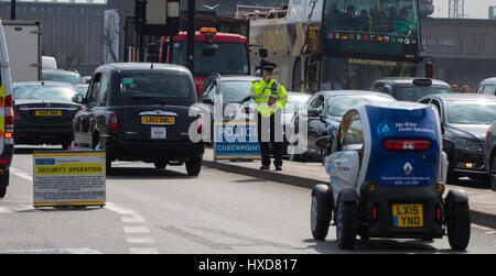 London, UK. 28th Mar, 2017. Police man at security checkpoint on Waterloo Bridge as the capital sees a marked increase in visible policing following the Westminster Bridge attack on the 22nd. Credit: Paul Davey/Alamy Live News Stock Photo