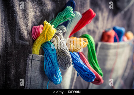 Closeup of colored threads in the mat tailor Stock Photo