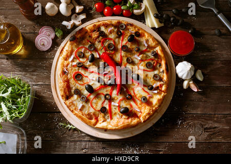 top view pizza with fresh red pepper and ingredients on wooden table Stock Photo