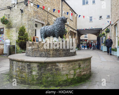 a view of Jill Tweed's black ram statue sculpture in the Woolmarket Wool Market in the center centre of Cirencester Stock Photo