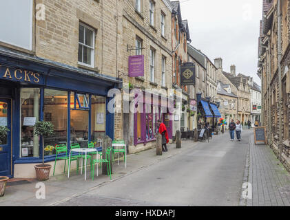 a view down up Black Jact Street St with independent shops and pedesdrians, Cirencester UK