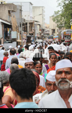 A crowded street in an Indian village during a hindu festival Stock Photo
