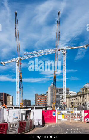 Construction cranes at the new development in Chamberlain Square in Birmingham at the site of the old central library in Paradise Circus Stock Photo