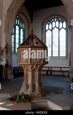 The font in All Saints Church, Thornham, Norfolk, England, UK Stock Photo