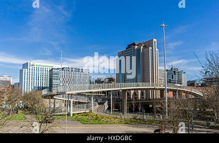 M8 motorway through central Glasgow Scotland UK with Scottish Power building behind St Vincent Plaza L and Hilton Glasgow hotel R & pedestrian bridge Stock Photo