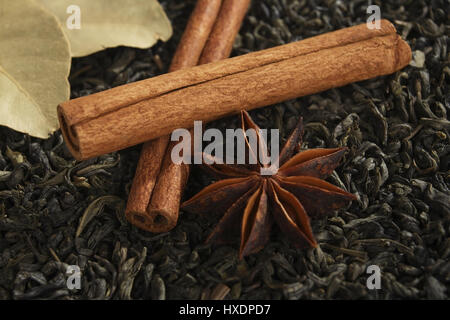 Aniseed star, cinnamon sticks, bay leaves with tea mixture, Anisstern, Zimtstangen, Lorbeerblaetter mit Teemischung Stock Photo
