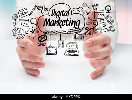 Digital composite of Hands on table and black digital marketing doodles against blue pink background Stock Photo
