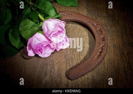 Roses with a horseshoe, Roses with a horseshoe |, Rosen mit einem Hufeisen |Roses with a horseshoe| Stock Photo