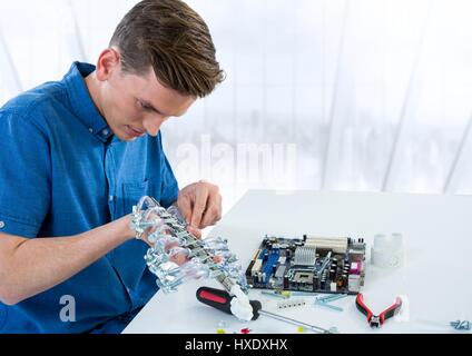 Digital composite of Man with electronics against blurry window Stock Photo