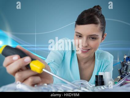 Digital composite of Woman with electronics and screwdriver against blue background with waves Stock Photo