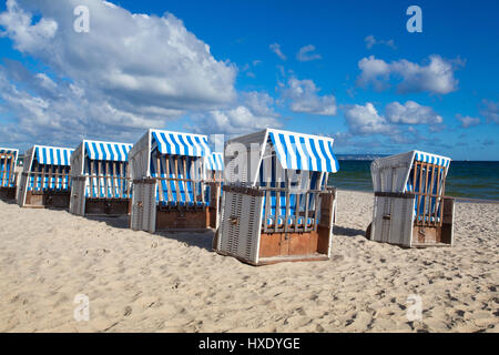 Sandy beach and traditional wooden beach chairs on Rugen island, Northern Germany, on the coast of Baltic Sea Stock Photo
