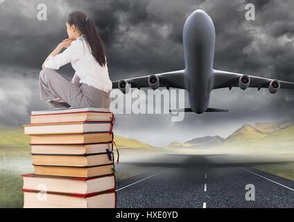 Digital composite of Business woman sitting on Books stacked by plane take off runway Stock Photo