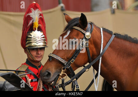 Kathmandu, Nepal. 27th Mar, 2017. A Nepalese Army arrives along with his horse to take part in Ghode Jatra or the 'Festival of Horse' celebrated at the Army Pavilion, Tudikhel, Kathmandu, Nepal on Monday, March 27, 2017. Nepalese Army blessing his horse before parade during Ghode Jatra or the 'Festival of horse' celebrated at the Army Pavilion, Tudikhel, Kathmandu, Nepal on Monday, March 27, 2017. Credit: PACIFIC PRESS/Alamy Live News Stock Photo