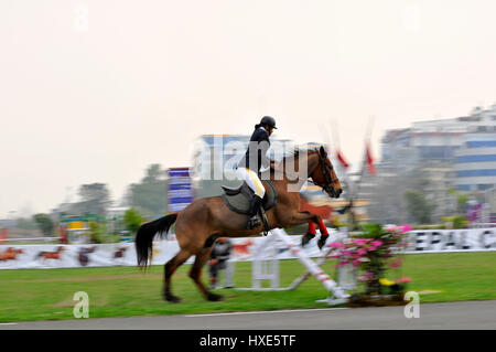 Kathmandu, Nepal. 27th Mar, 2017. Nepaleses Army Horse Cavalry perform horse riding skills during Ghode Jatra or the 'Festival of Horse' celebrated at the Army Pavilion, Tudikhel, Kathmandu, Nepal on Monday, March 27, 2017. Ghode Jatra, meaning Horse Parade is organized at the Army Pavilion, Tudikhel, Kathmandu, Nepal every year. It is said Ghode Jatra was organized to celebrate the victory over a demon named Tundi who reside over the field known as Tundikhel. Credit: PACIFIC PRESS/Alamy Live News Stock Photo