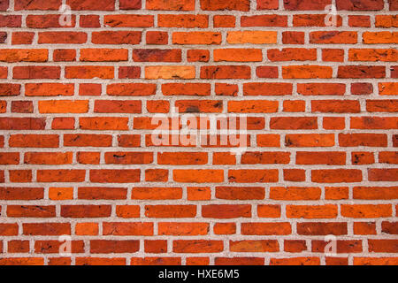 Scandinavian brickwork pattern, orange clay brick wall background Stock Photo