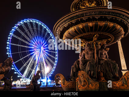 Night Big wheel on Place de la Concorde at the end of Champs-Élysées. Paris, France, europe Stock Photo