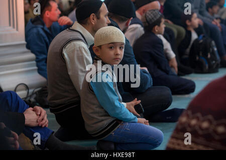 Muslim boy participates at the annual Koran festival in the Moscow Cathedral Mosque, Russia Stock Photo