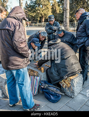 Elderly Chinese men playing Chinese checkers in the Temple of Heaven Park in Beijing, China. Stock Photo