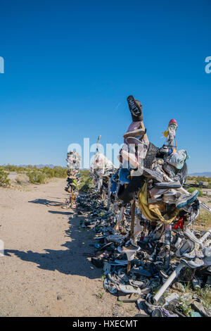 Shoe garden, Rice, California. Rice became noted for its Rice Shoe Tree, a lone tamarisk on a turnout just south of highway CA 62. For reasons unknown Stock Photo